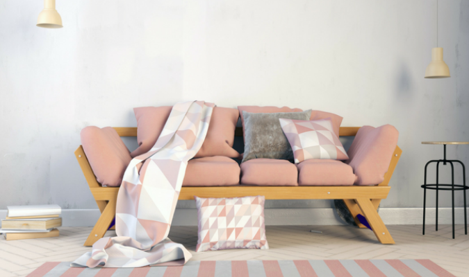 Scatter cushions and a matching throw blanket on a sofa