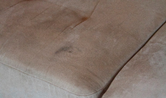 Dark Ink Stain On Grey Fabric Sofa (1)
