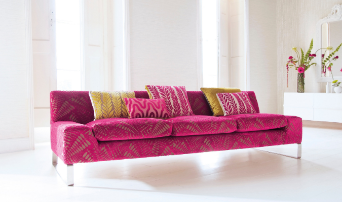 Fibre filled pink sofa with cushions