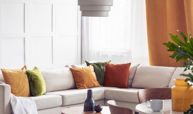 White sofa with coloured cushions