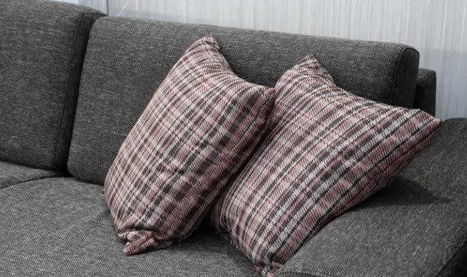 Quality sofa with plaid scatter cushions