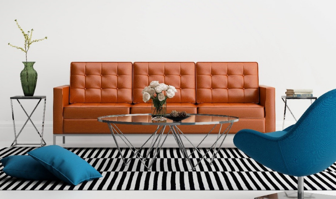 Orange sofa with blue chairs complementary colour