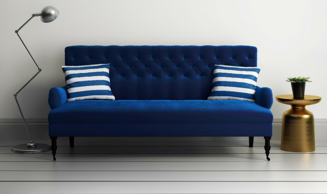 Practical blue velvet sofa with cushions
