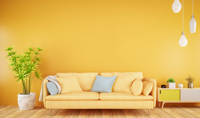 Yellow Sofa Against Yellow Wallpaper